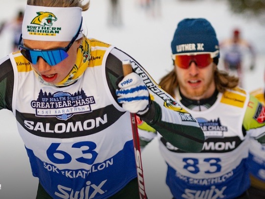 Nordic skiers wearing sublimated race bibs 63 and 83 at the Great Bear Chase 50K Skiathlon